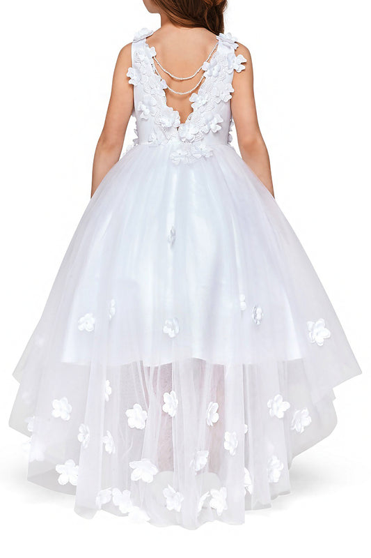 Young girl standing back-facing in white high-low tulle flower girl dress with lace-up closure, 3D flower lace accents, pearl trim neckline, and cascading skirt