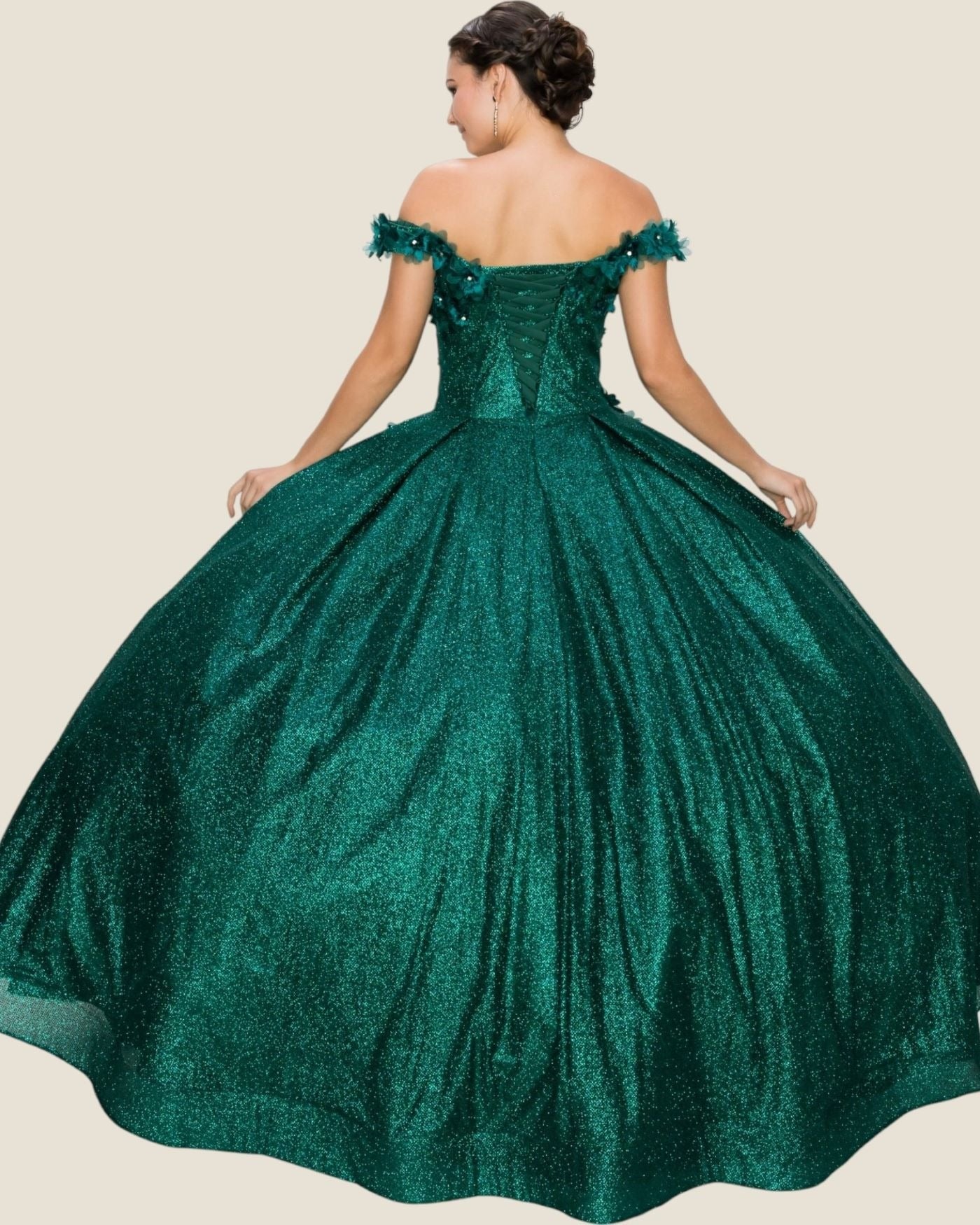 Green off-shoulder gown on a plain background
