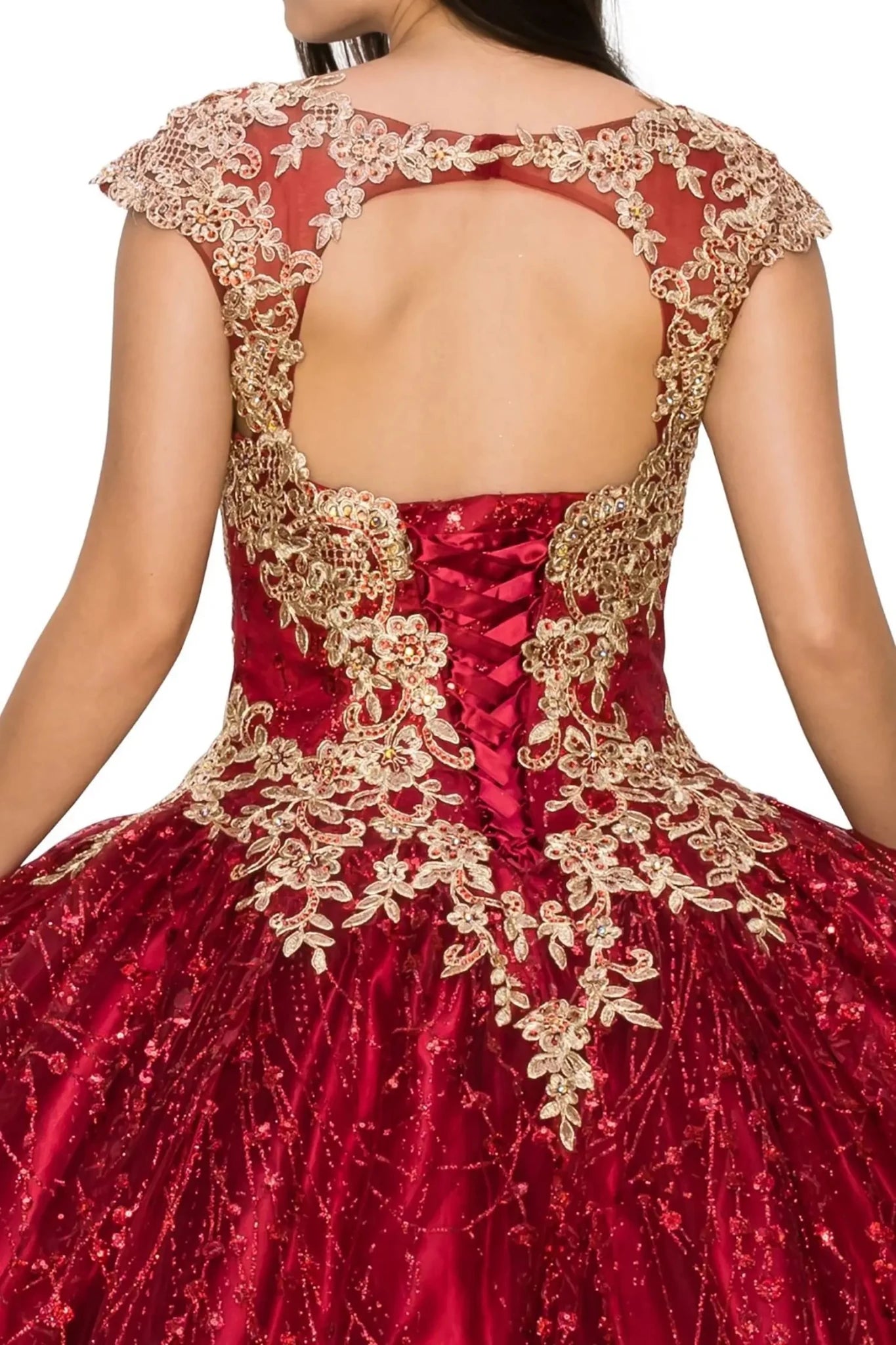 Red ball gown with gold lace details on a plain background