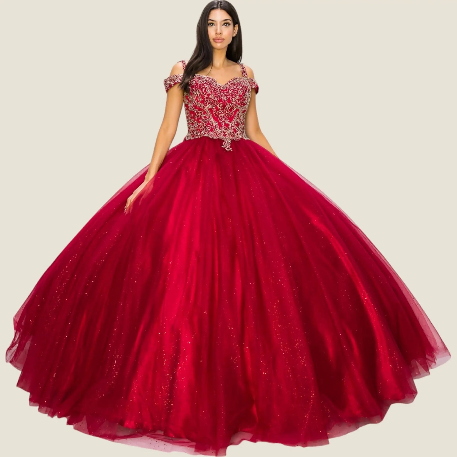 burgundy ball gown with intricate top design on a beige background