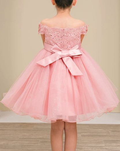 dusty rose off-shoulder dress with a bow on a neutral background