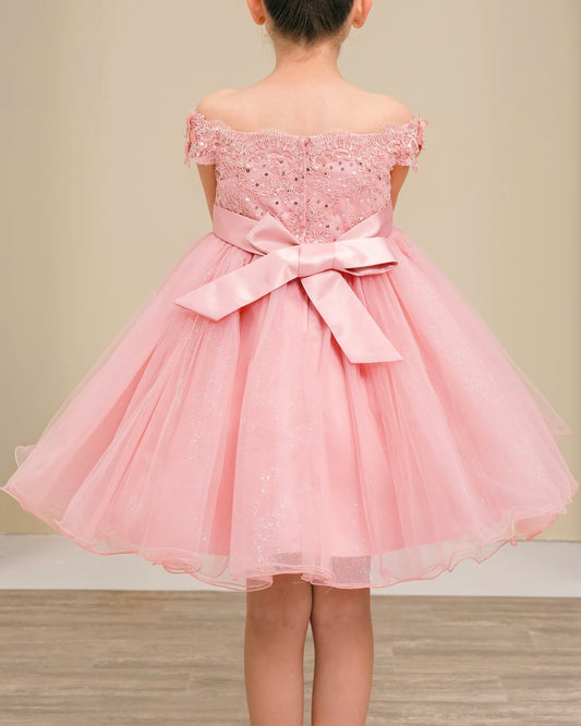 dusty rose off-shoulder dress with a bow on a neutral background