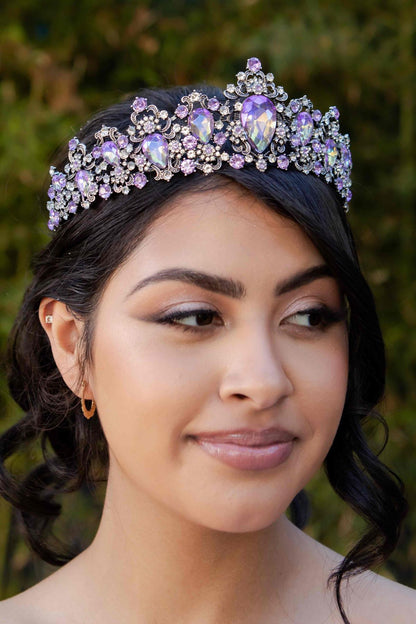 Woman wearing a decorative tiara with a blurred natural background