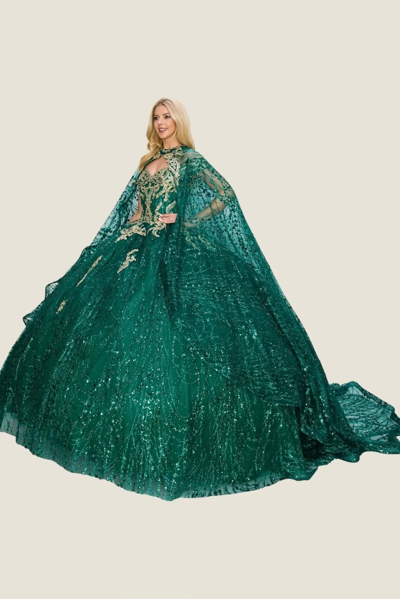 Woman wearing a green quinceanera gown with a cape on a beige background
