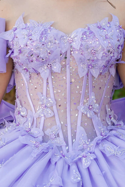 Detailed view of a lilac see through dress with floral and ribbon detail