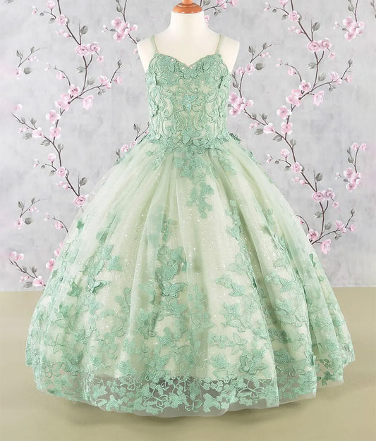Green lace dress on a mannequin with floral decorations in the background