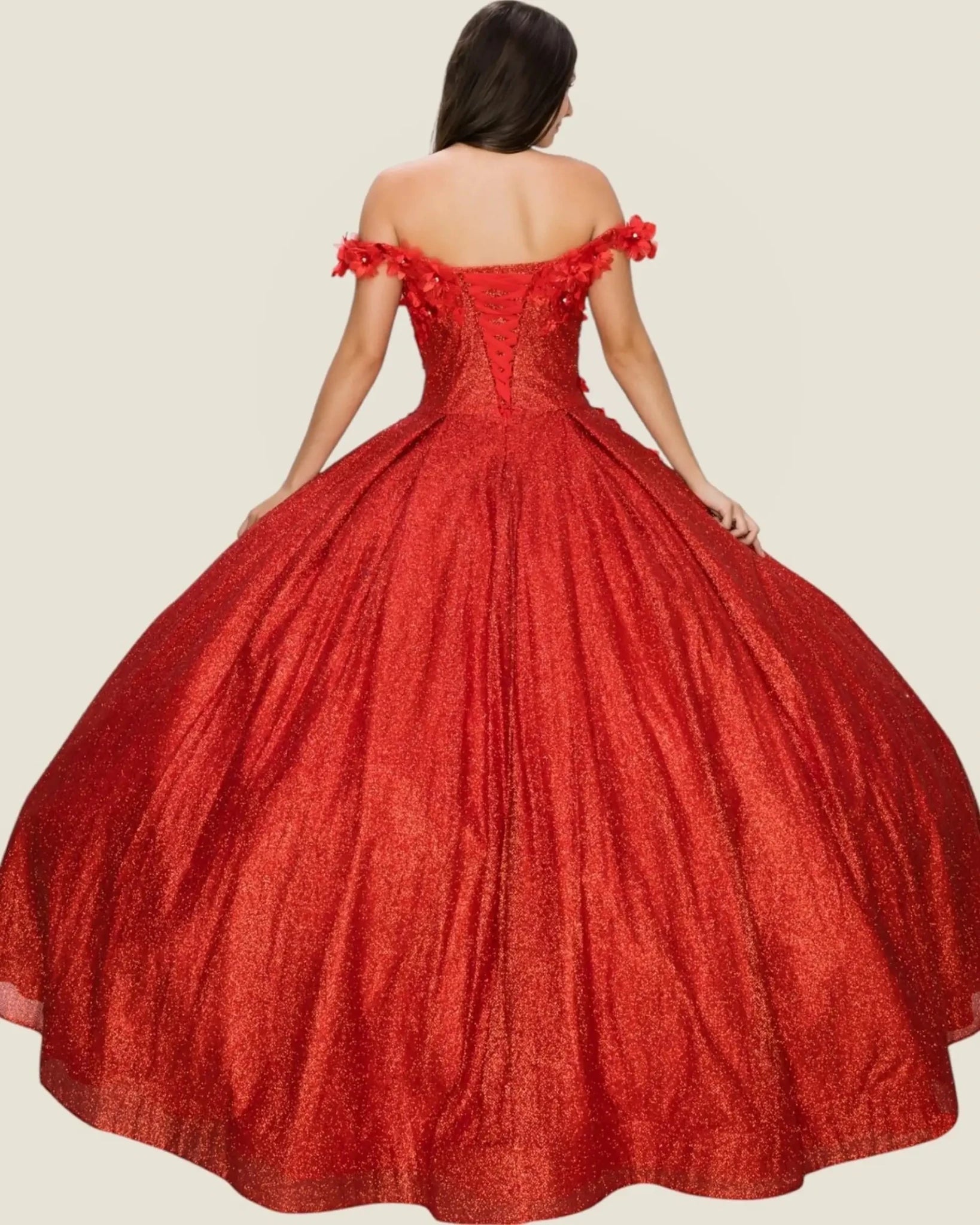 Red off-shoulder gown with floral details on a beige background