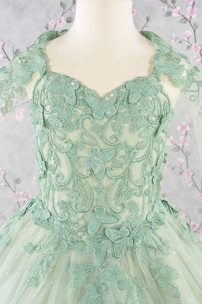 zoom in Green lace dress on a mannequin with a floral background