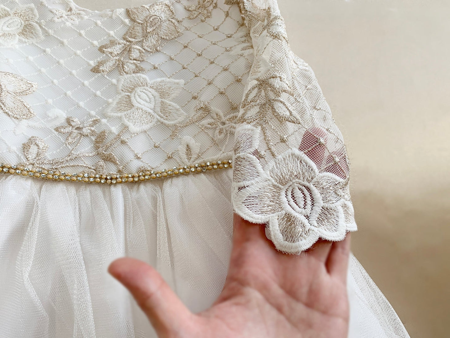 Off-white flower girl dress with 3/4 sleeves, lattice flower embroidered lace bodice, satin waist
