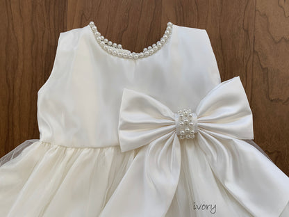 Ivory USA Made | Pearl Neckline & Pearl detail Bow Satin and Tulle Flower Girl Dress - zoomed in front view of bow and pearls on neckline