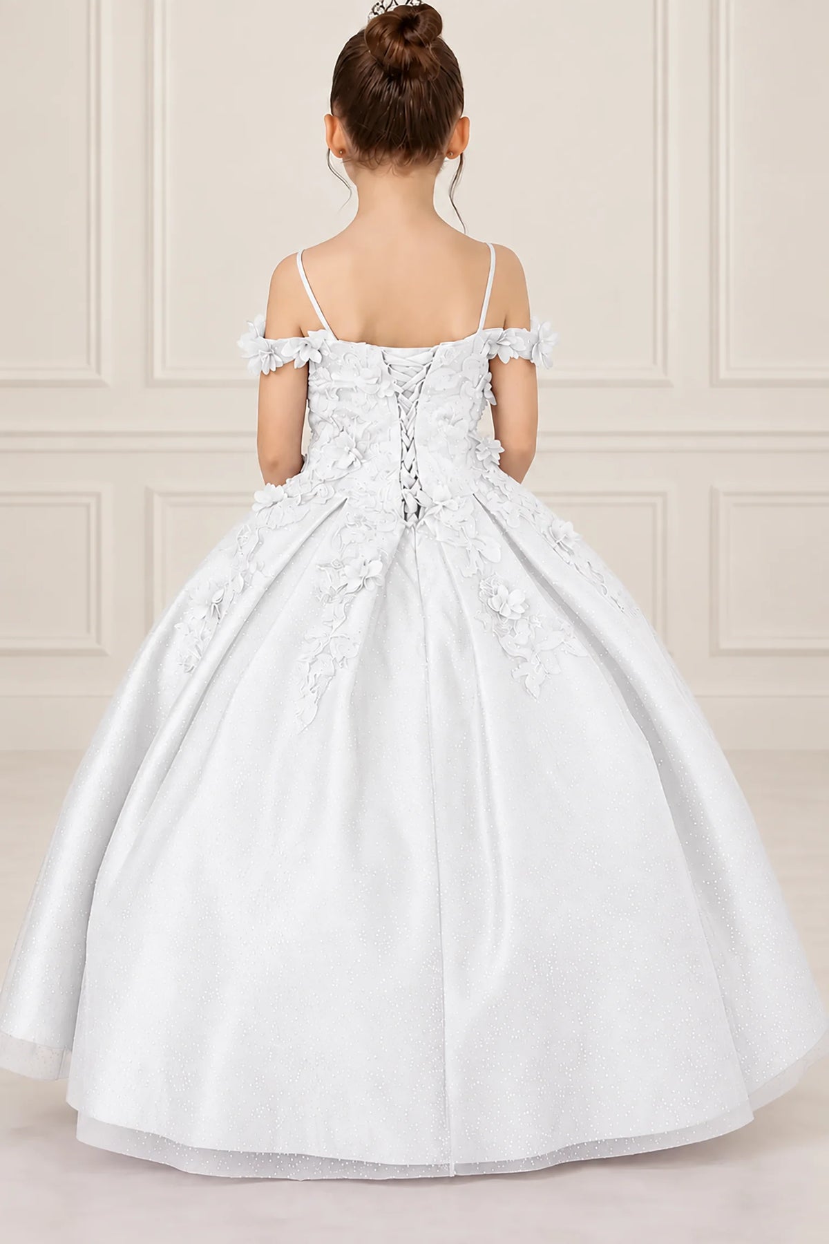 Lacing secures the back of the White mini quinceañera dress, framed by narrow straps and floral trim.