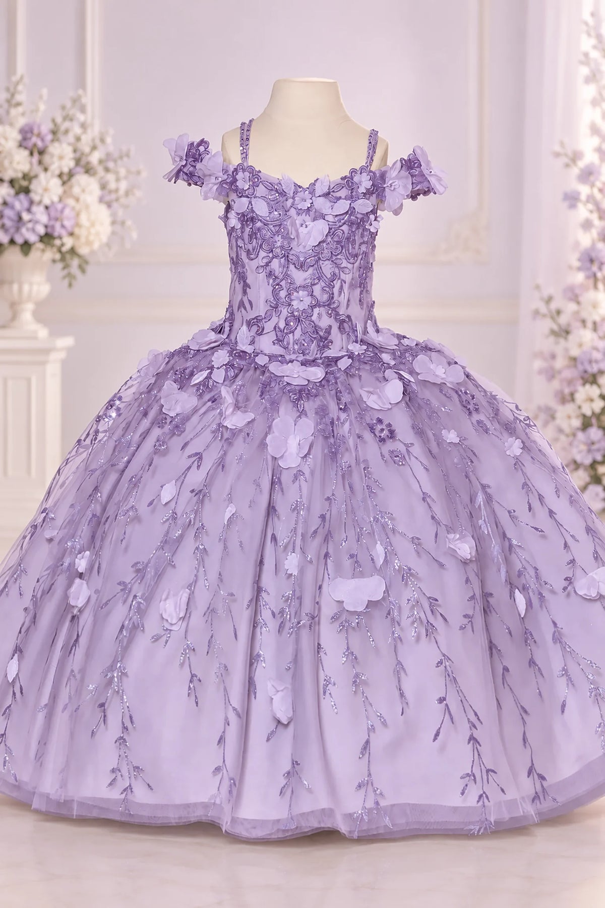 Delicate blossoms outline the sweetheart bodice of the Lilac mini quinceañera dress above a full tulle skirt.