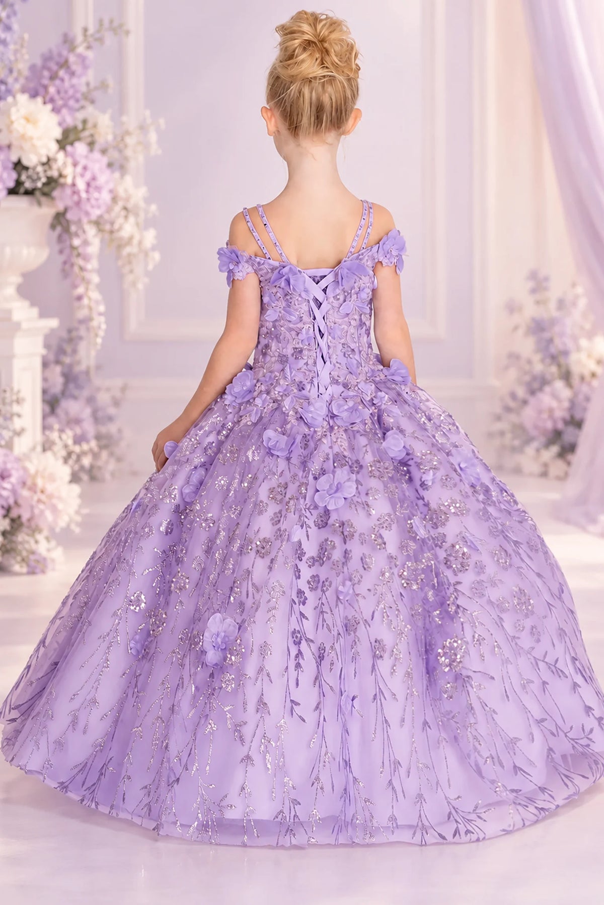 Corset lacing finishes the back of this Lilac mini quinceañera dress beneath delicate shoulder straps.