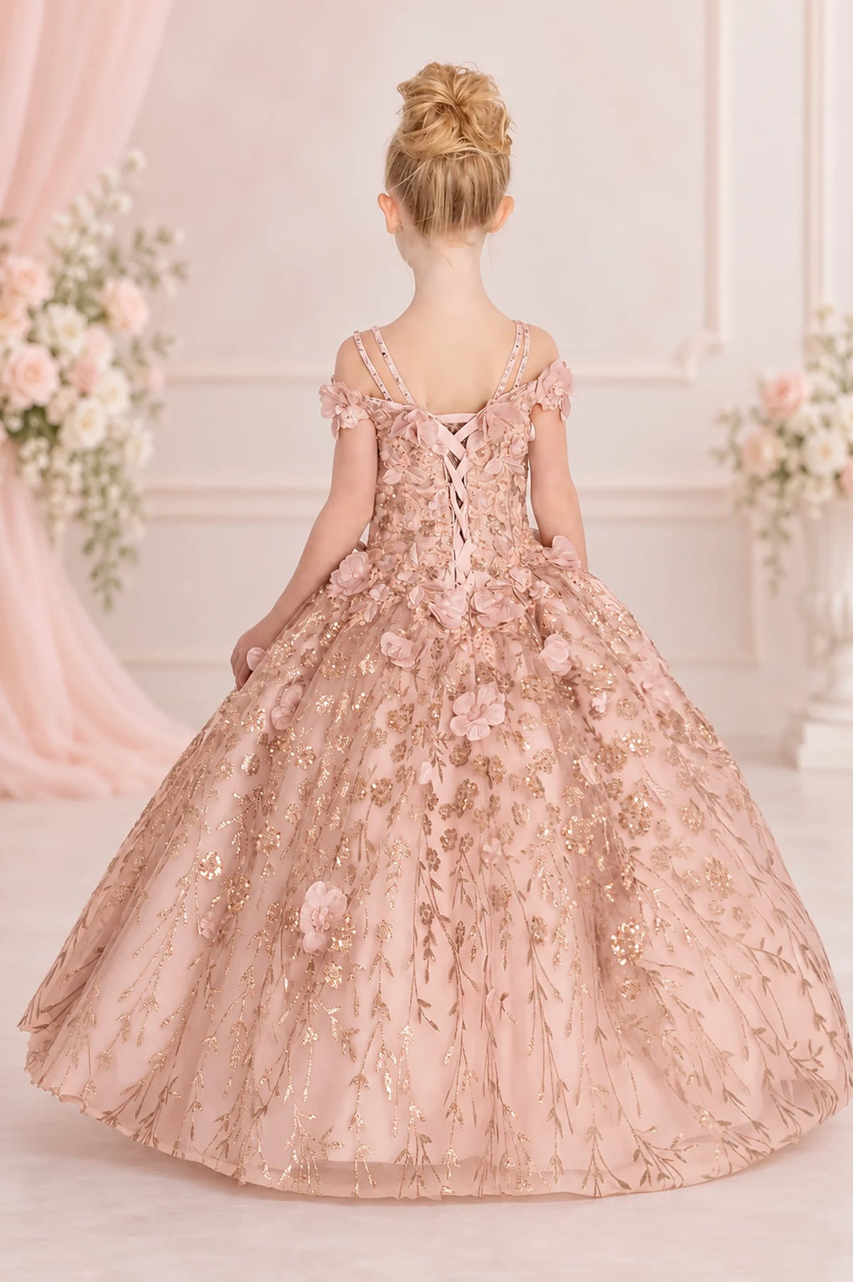 Corset lacing finishes the back of this Rose Gold mini quinceañera dress beneath delicate shoulder straps.