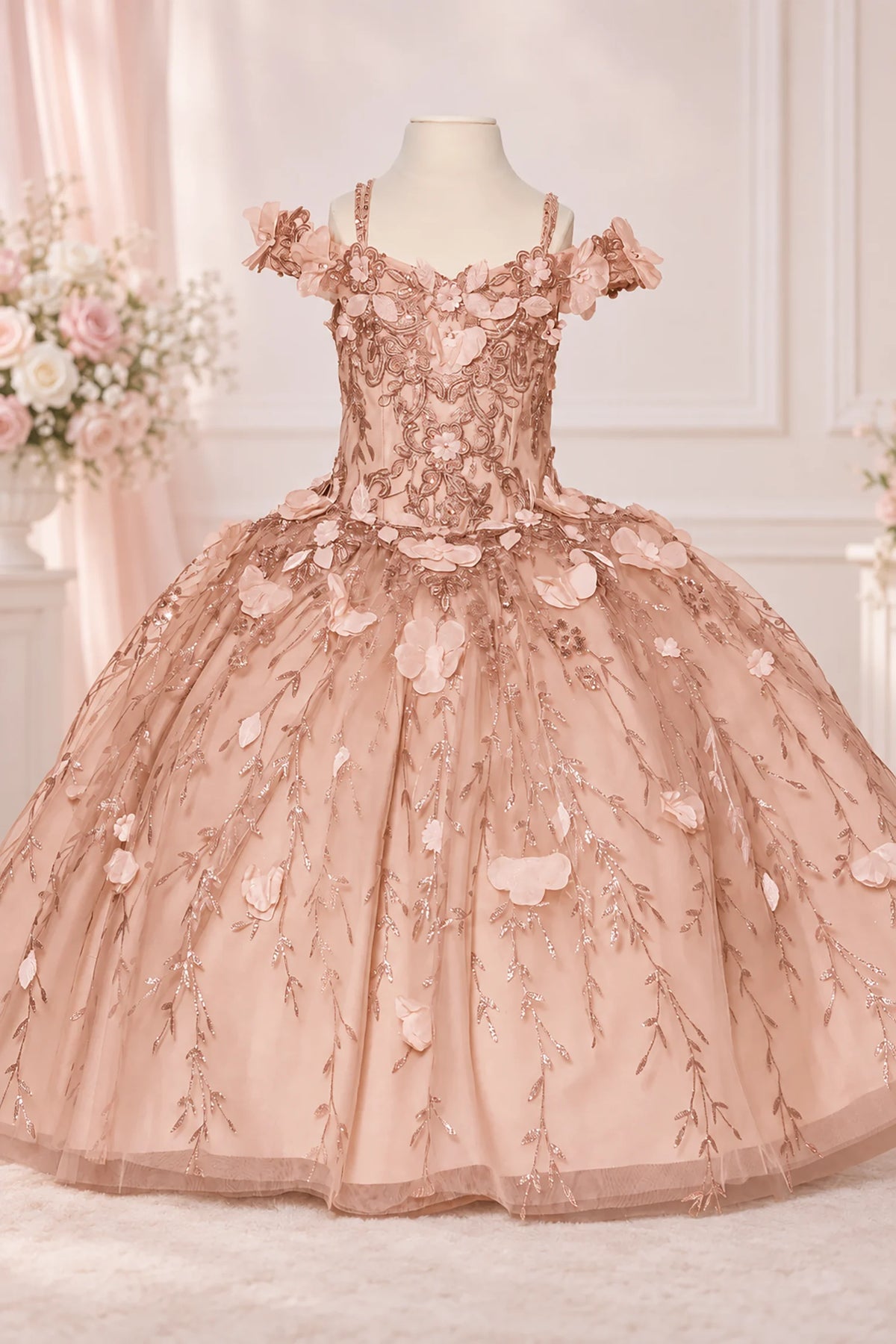 Delicate blossoms outline the sweetheart bodice of the Rose Gold mini quinceañera dress above a full tulle skirt.