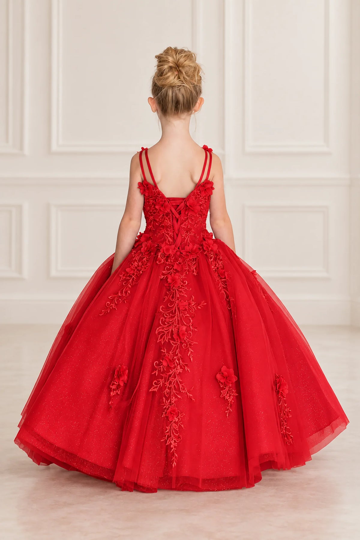 Lace-up detailing shapes the back of the Red mini quinceañera dress beneath slender paired straps.