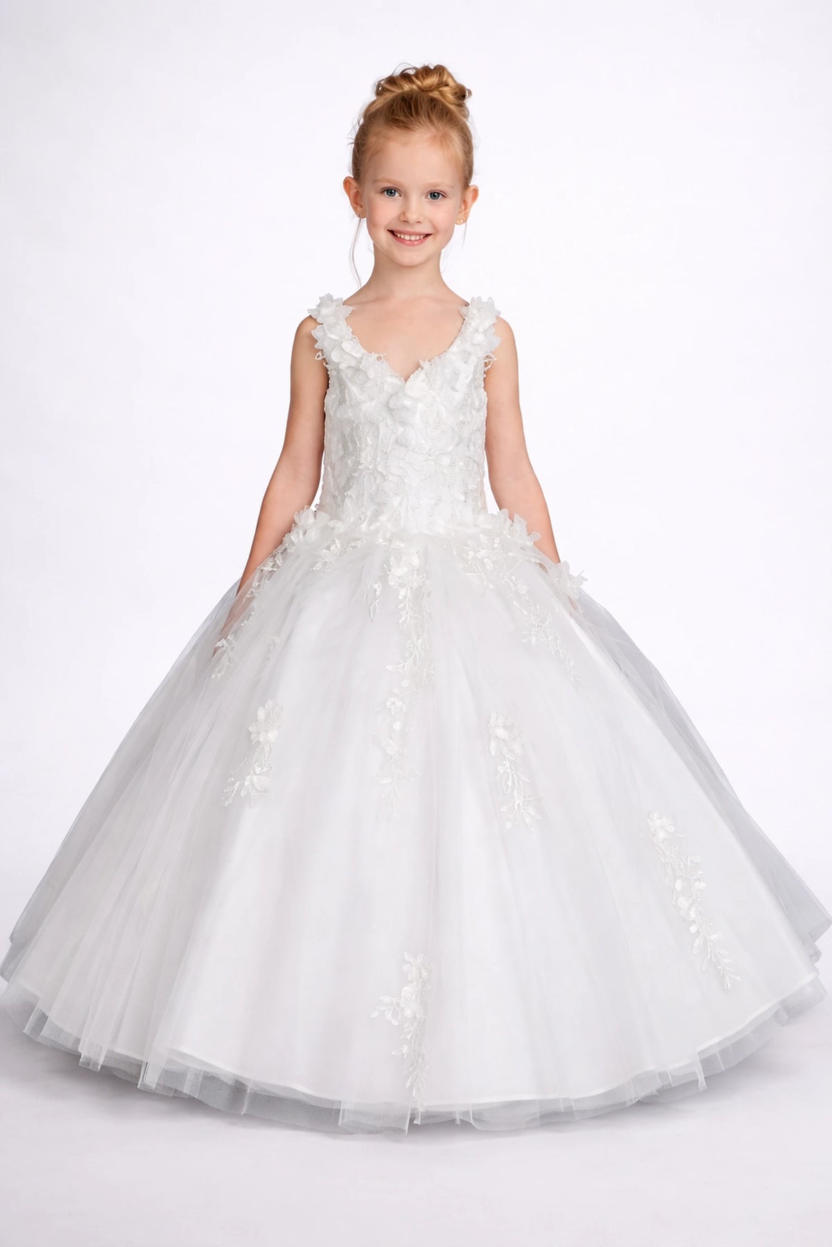 Shimmering from top to hem, the White mini quinceañera dress shows lace appliqué falling from the v-neck bodice onto the white skirt.