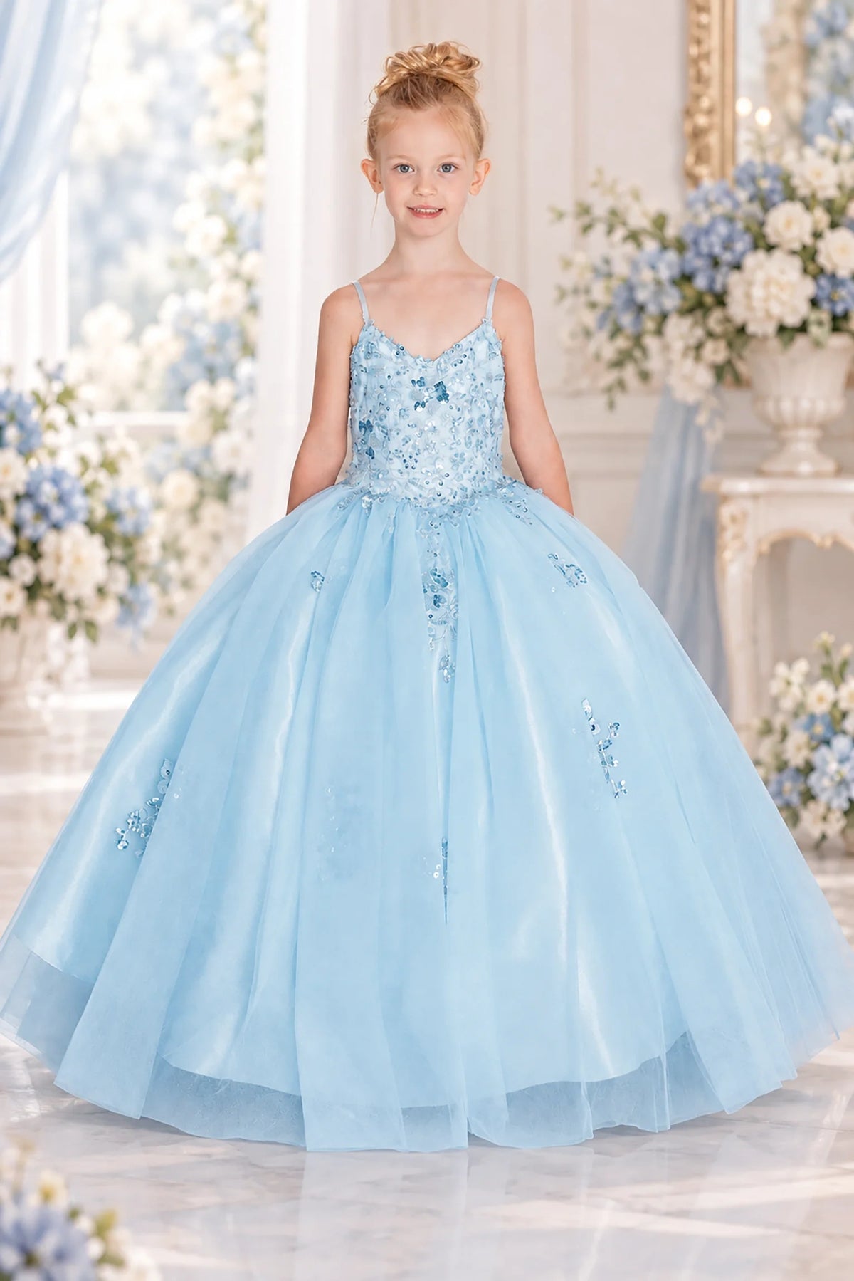 Shimmering from top to hem, the Bahama Blue mini quinceañera dress shows crystal beading across the fitted bodice and airy tulle skirt.