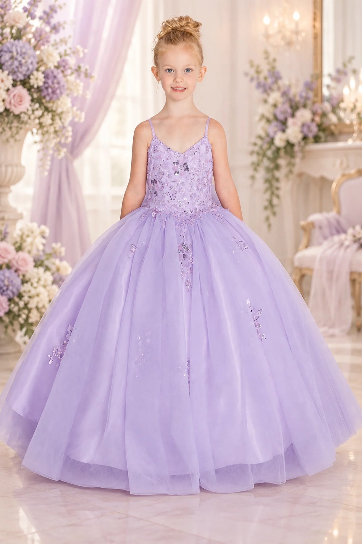 Framed by a full skirt, the Lilac mini quinceañera dress shows crystal beading across the fitted bodice and airy tulle skirt.