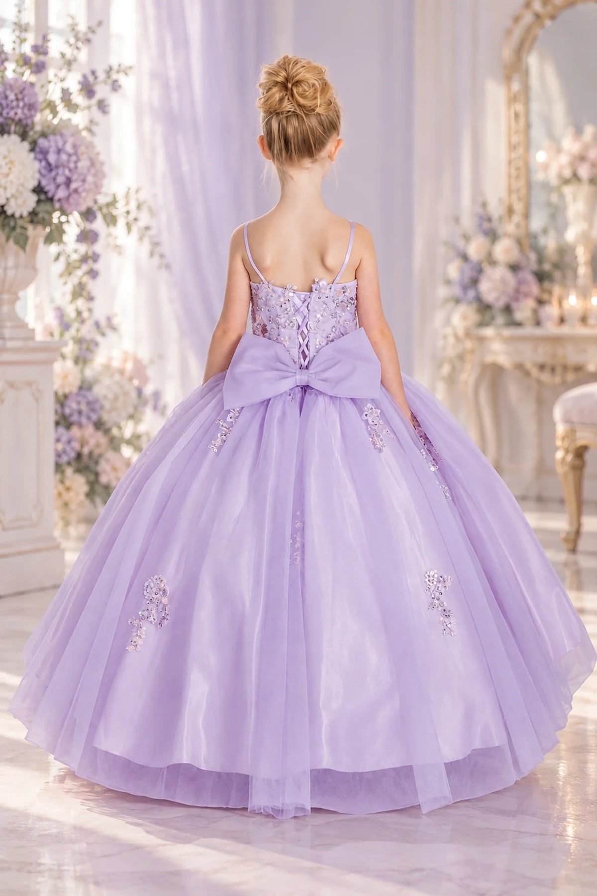The reverse view reveals, the Lilac mini quinceañera dress features oversized satin bow beneath a lace-up back.
