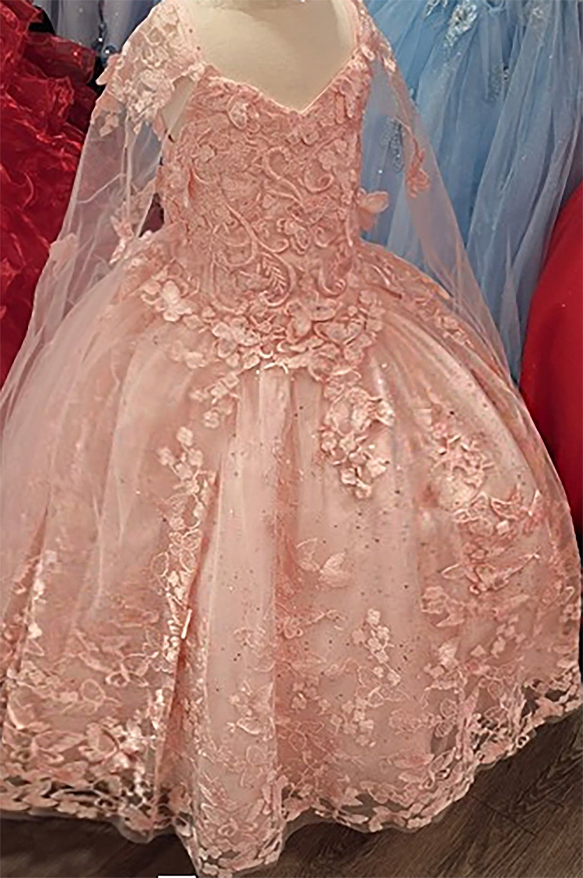 Pink lace mini quince dress with floral details.