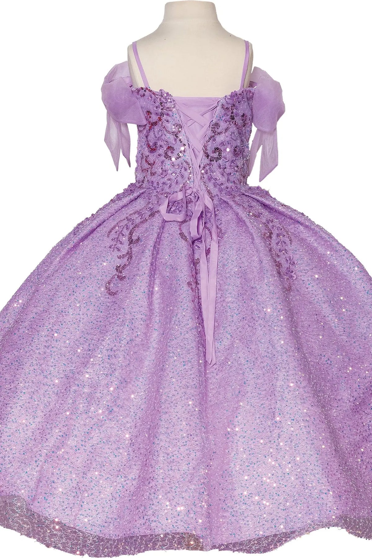Turning to the back, the Lilac mini quinceañera dress features lace-up back framed by soft puff sleeves.