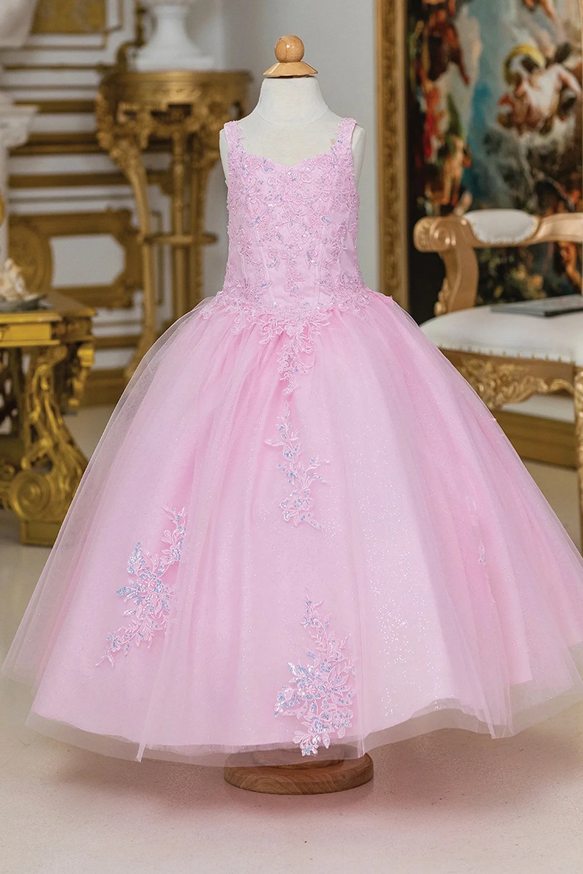 Shimmering from top to hem, the Pink mini quinceañera dress shows delicate embroidery along the square neckline and full skirt.