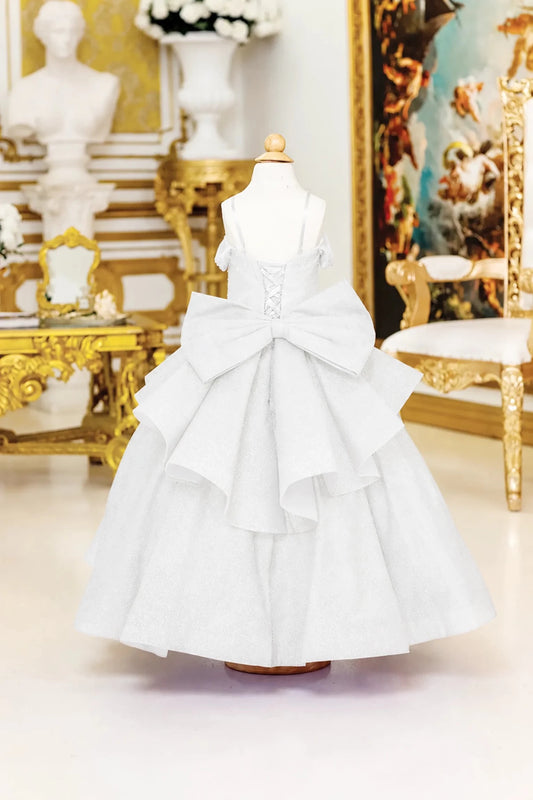 An oversized tiered bow frames the lace-up back of the Off-White mini quinceañera dress.