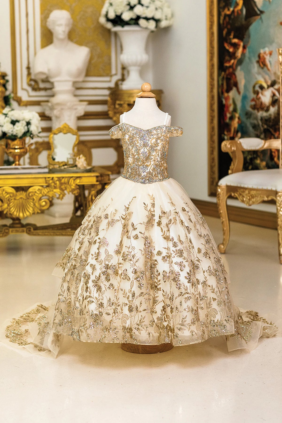 Detailed through the bodice, the Champagne mini quinceañera dress shows metallic floral embroidery over the fitted bodice and skirt.