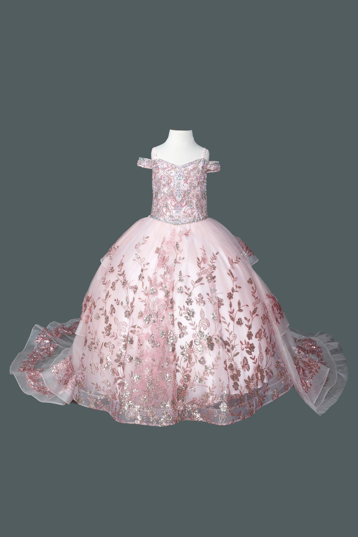 Across the front, the Rose Gold mini quinceañera dress shows metallic floral embroidery over the fitted bodice and skirt.