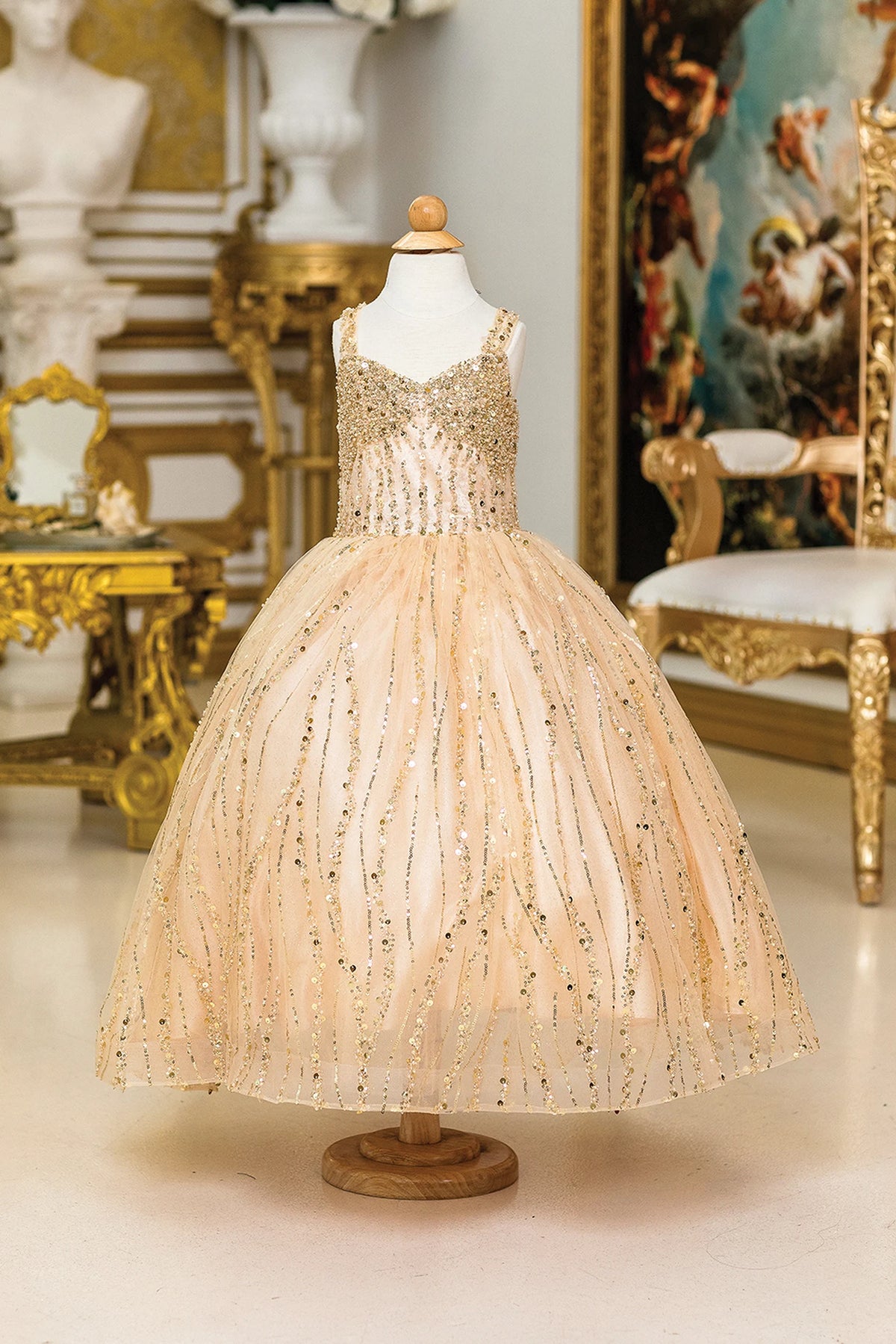 Shimmering from top to hem, the Gold mini quinceañera dress shows beading and vertical sequin trails across the full silhouette.
