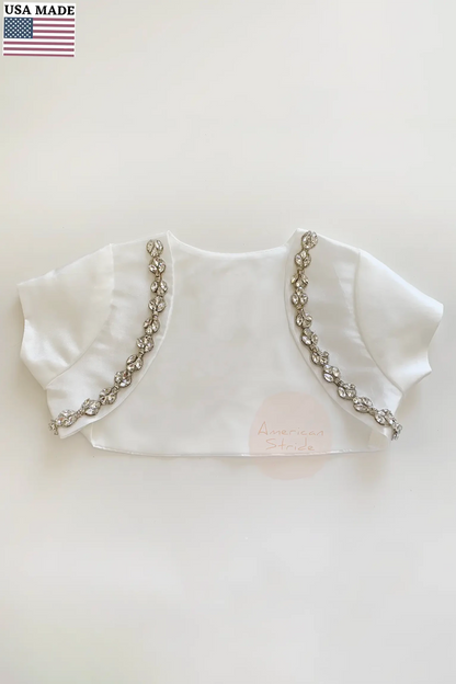 White bolero with rhinestone details on a light background
