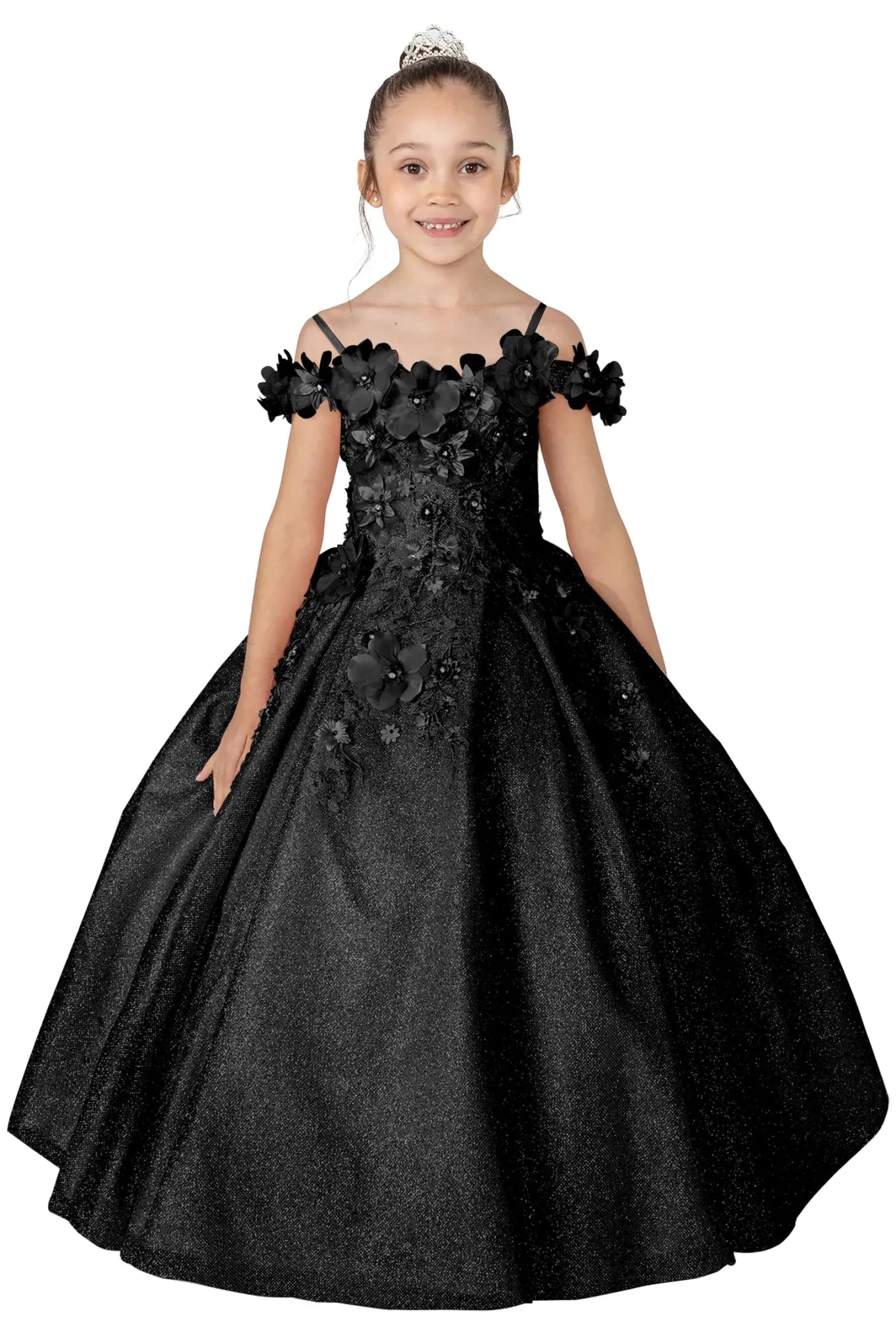 Young girl standing front-facing in black kids mini quinceañera dress with floral shoulder appliqués and glitter tulle layered skirt