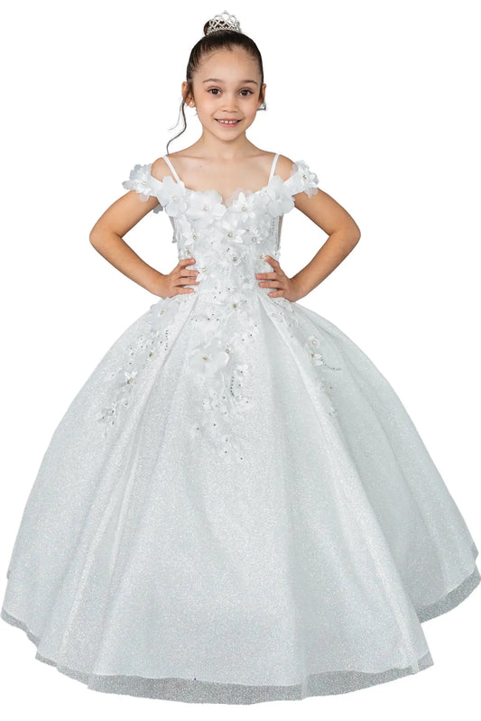 Young girl standing front-facing in white kids mini quinceañera dress with floral shoulder appliqués and glitter tulle layered skirt