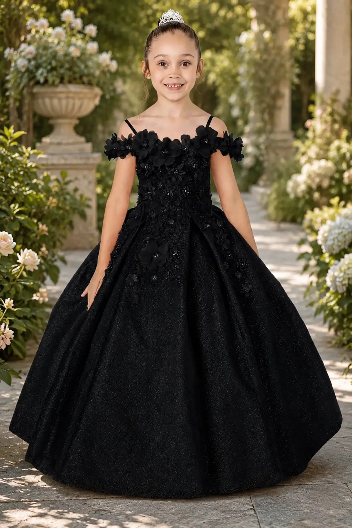 Black kids mini quinceañera mini quince dress with floral shoulder appliqués and glitter tulle layered skirt.