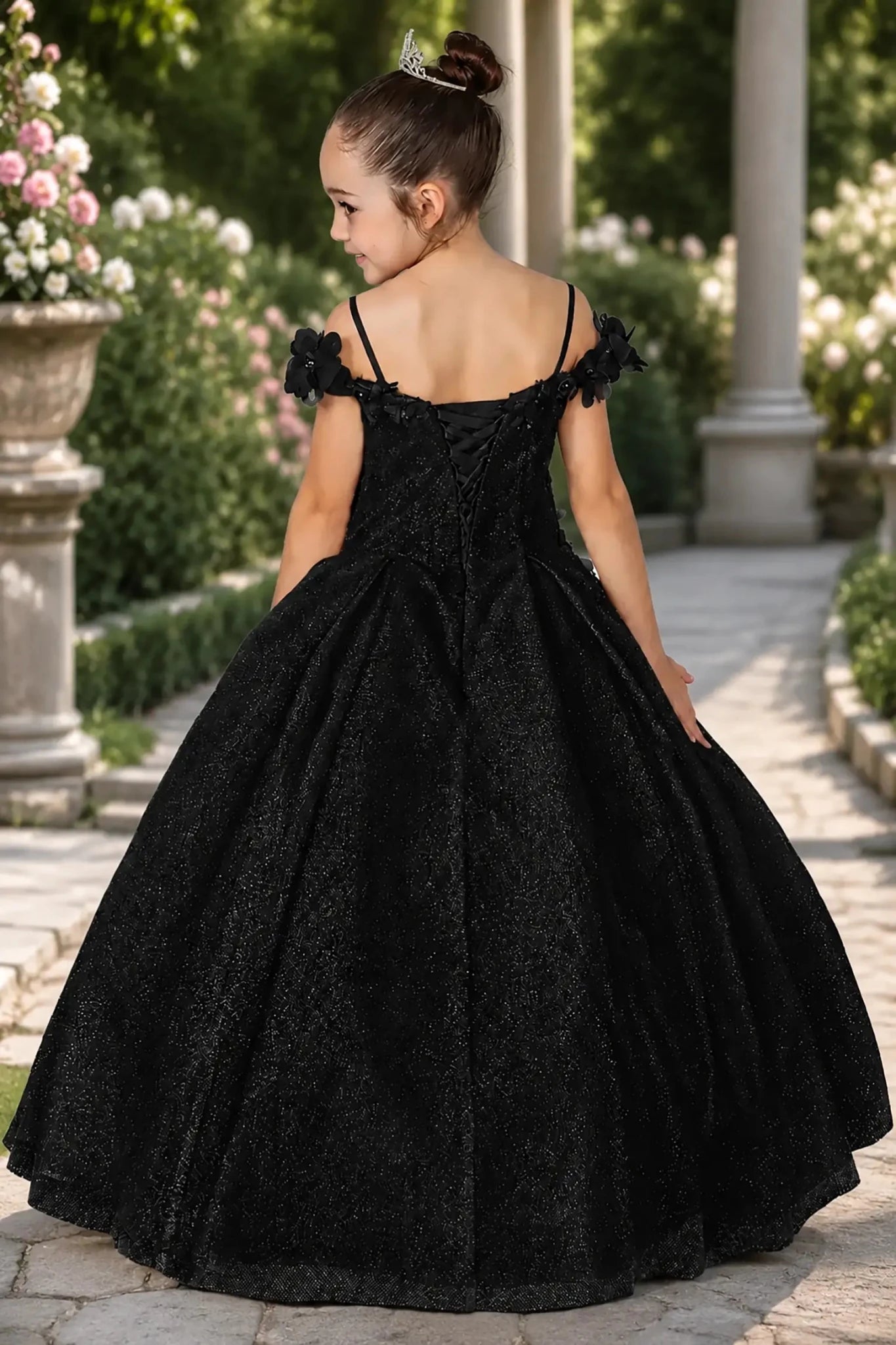 A black mini quince dress with lace up back.