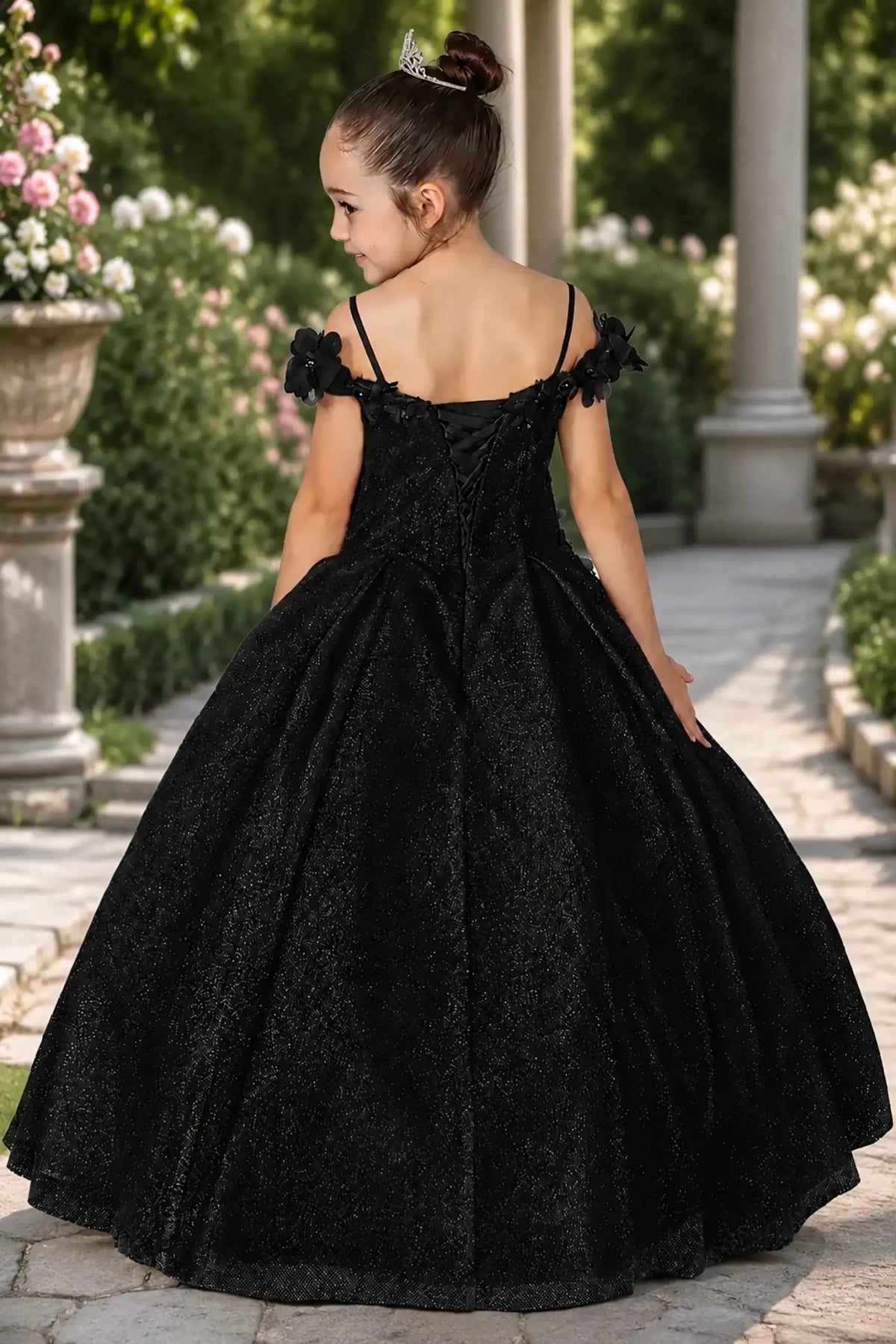 A black mini quince dress with lace up back.