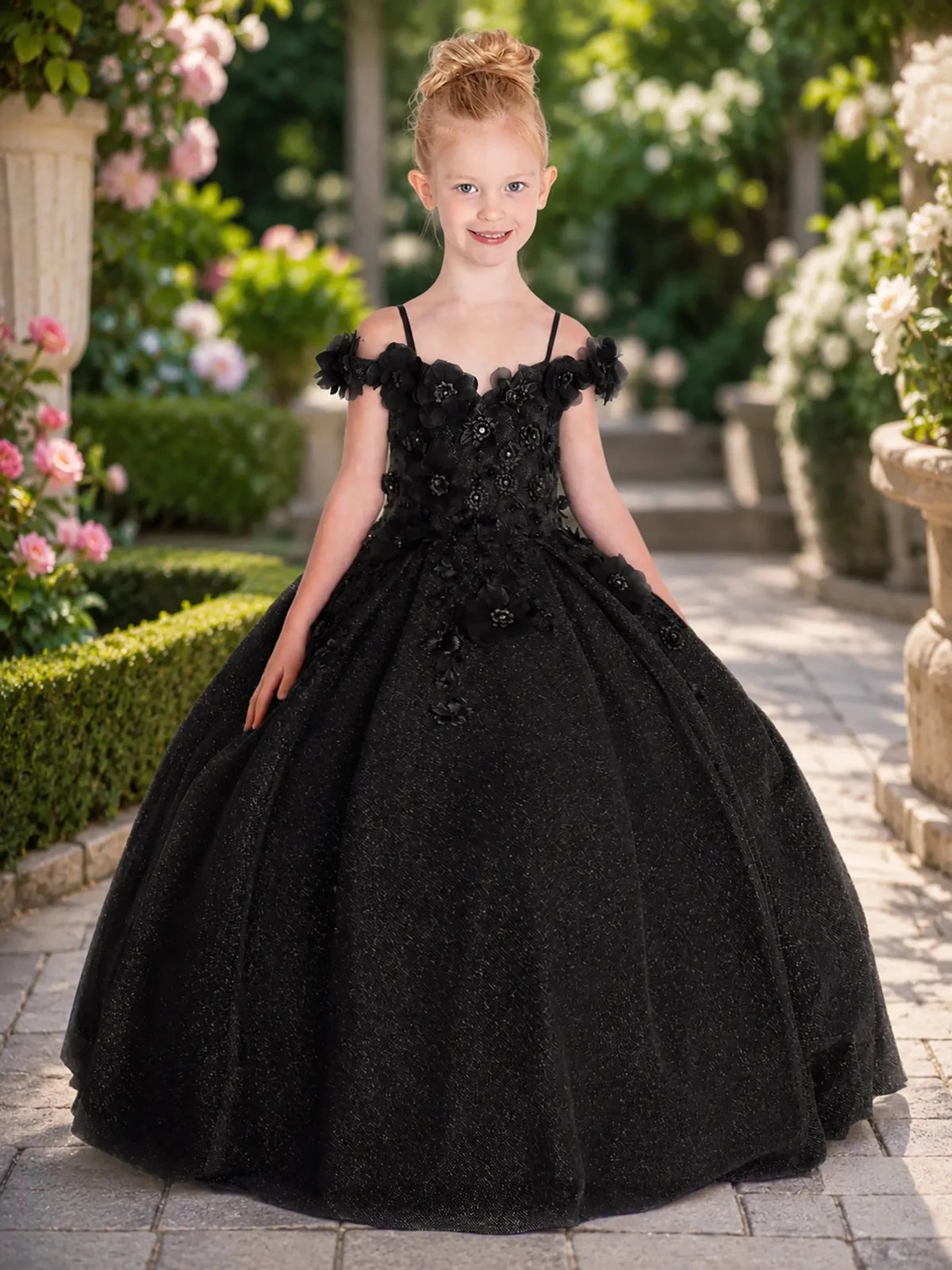 Black kids mini quinceañera mini quince dress with floral shoulder appliqués and glitter tulle layered skirt.
