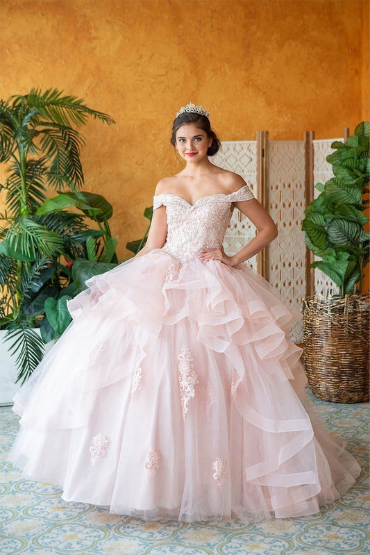 Blush Pink quinceañera ball gown featuring an embroidered off-shoulder neckline and cascading skirt ruffles.