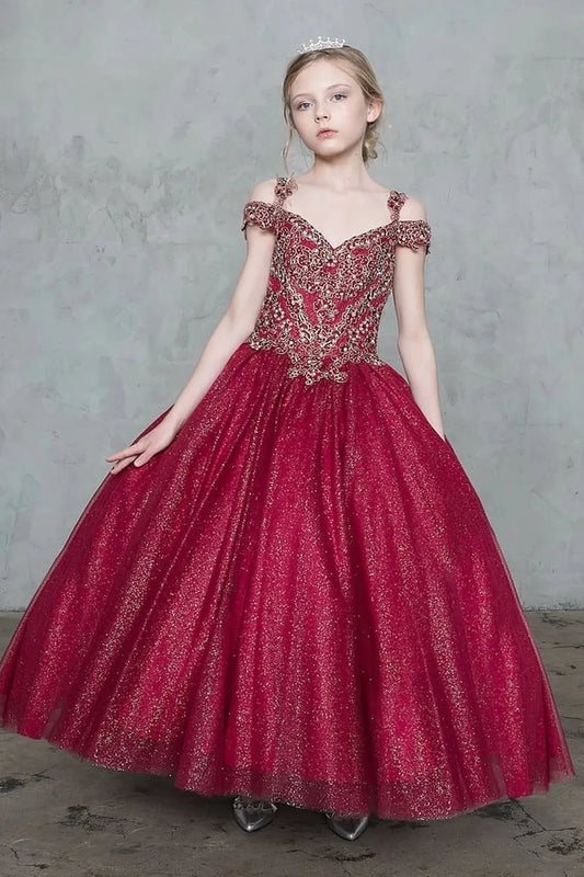 In full view, the Burgundy mini quince dress showcases sparkling embroidered off-the-shoulder bodice and shimmering full tulle ball gown skirt.