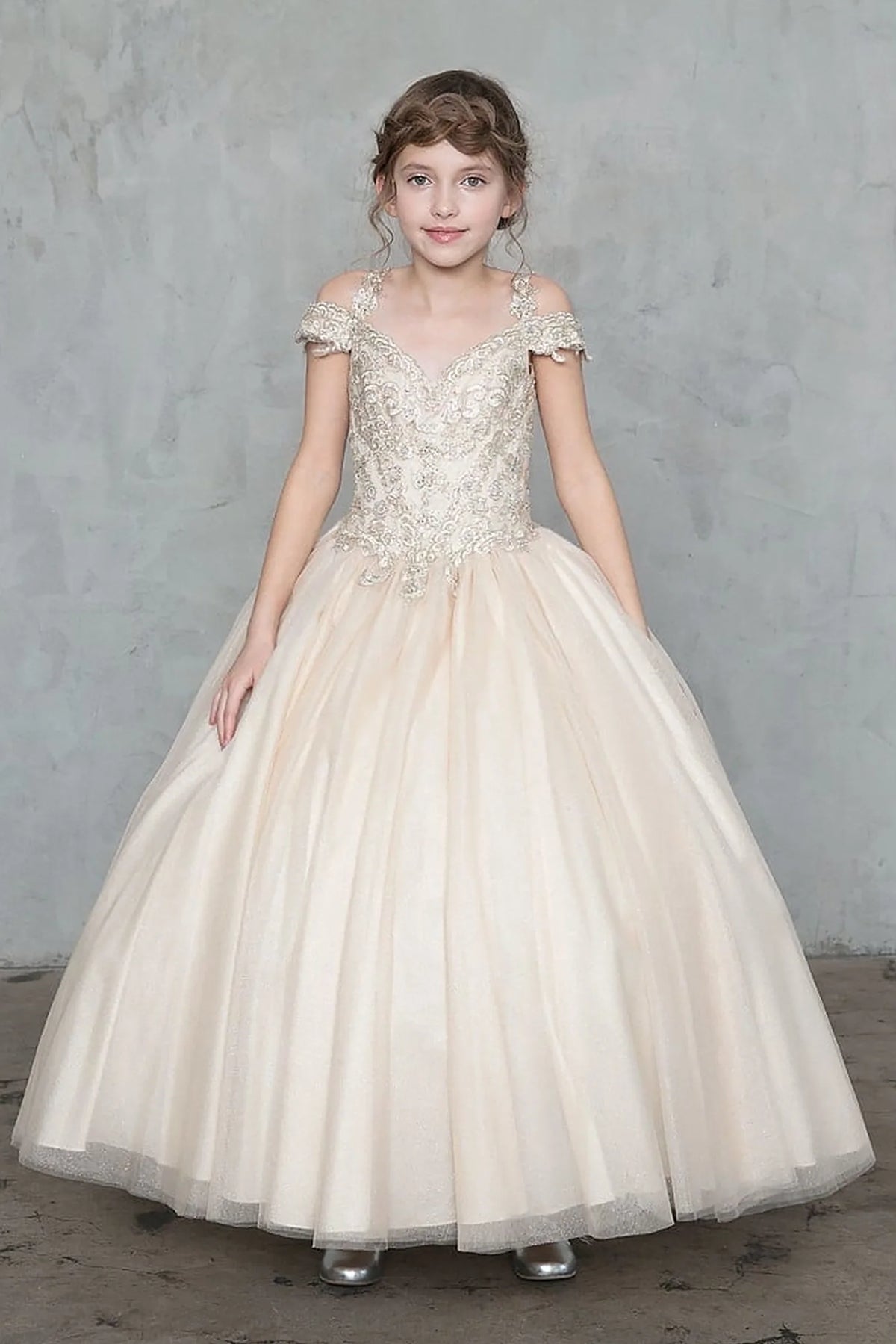 Across the silhouette, the Champagne mini quince dress showcases sparkling embroidered off-the-shoulder bodice and shimmering full tulle ball gown skirt.