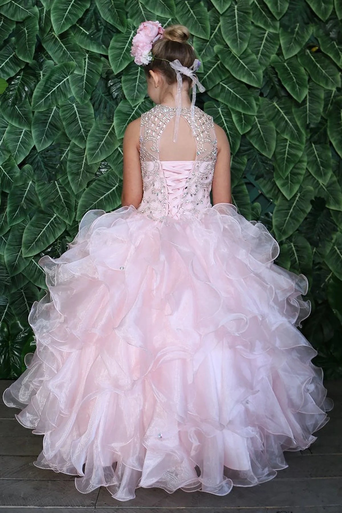 Turning to the back, the Blush mini quince dress displays its lace-up finish and playful tiered organza ruffle skirt.