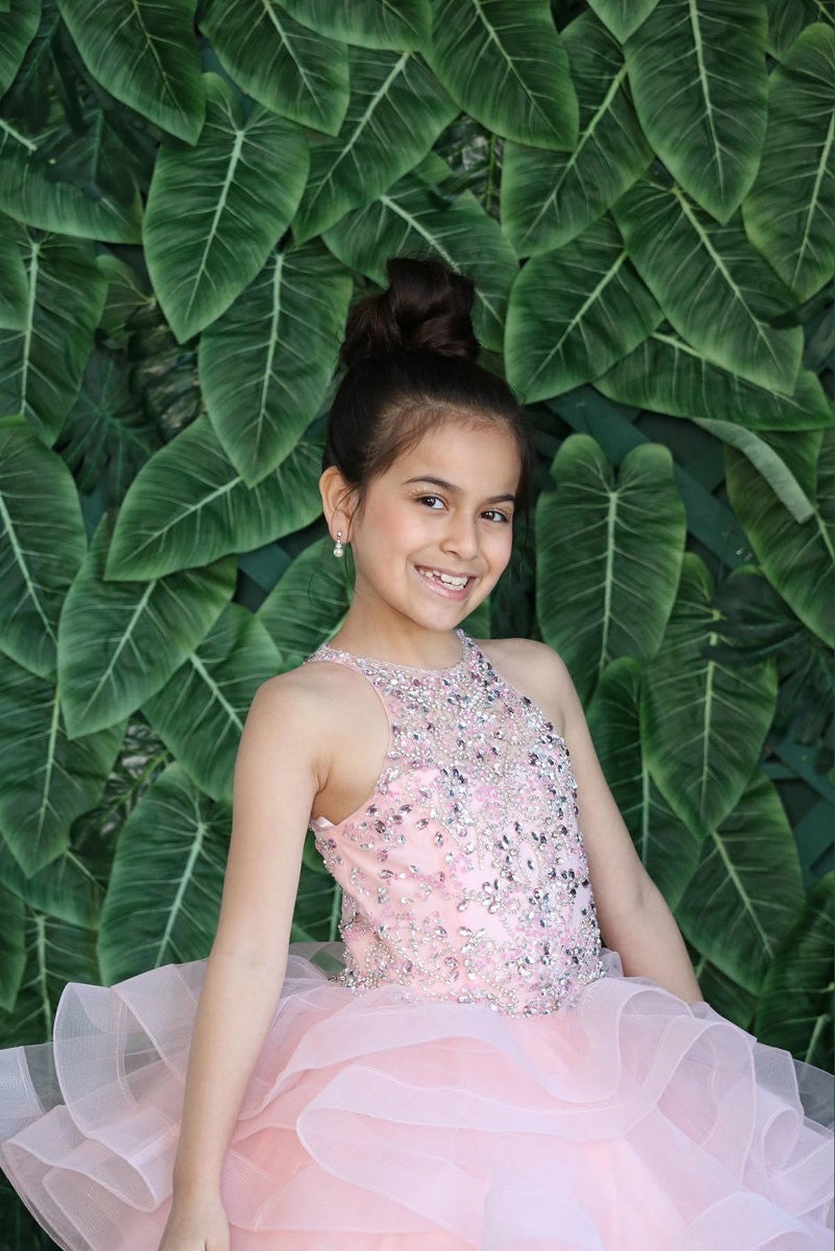 A closer crop highlights the jeweled sleeveless bodice on the Blush Pink mini quince dress.