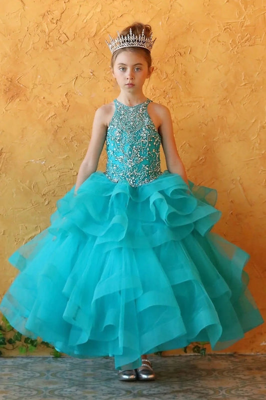 Rich texture defines, the Capri mini quince dress showcases jeweled sleeveless bodice and dimensional tiered ruffle skirt.