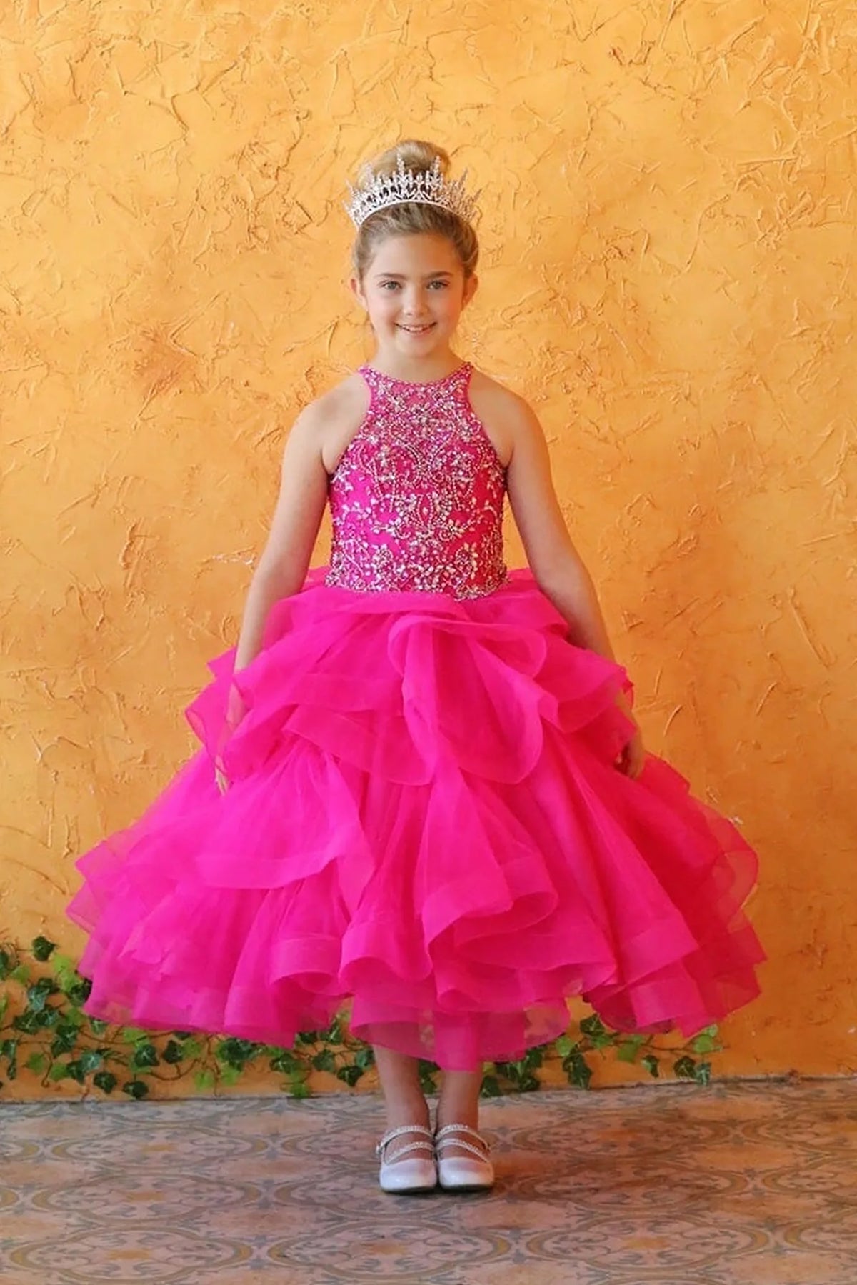 An alternate angle captures dimensional tiered ruffle skirt on the Magenta mini quince dress.