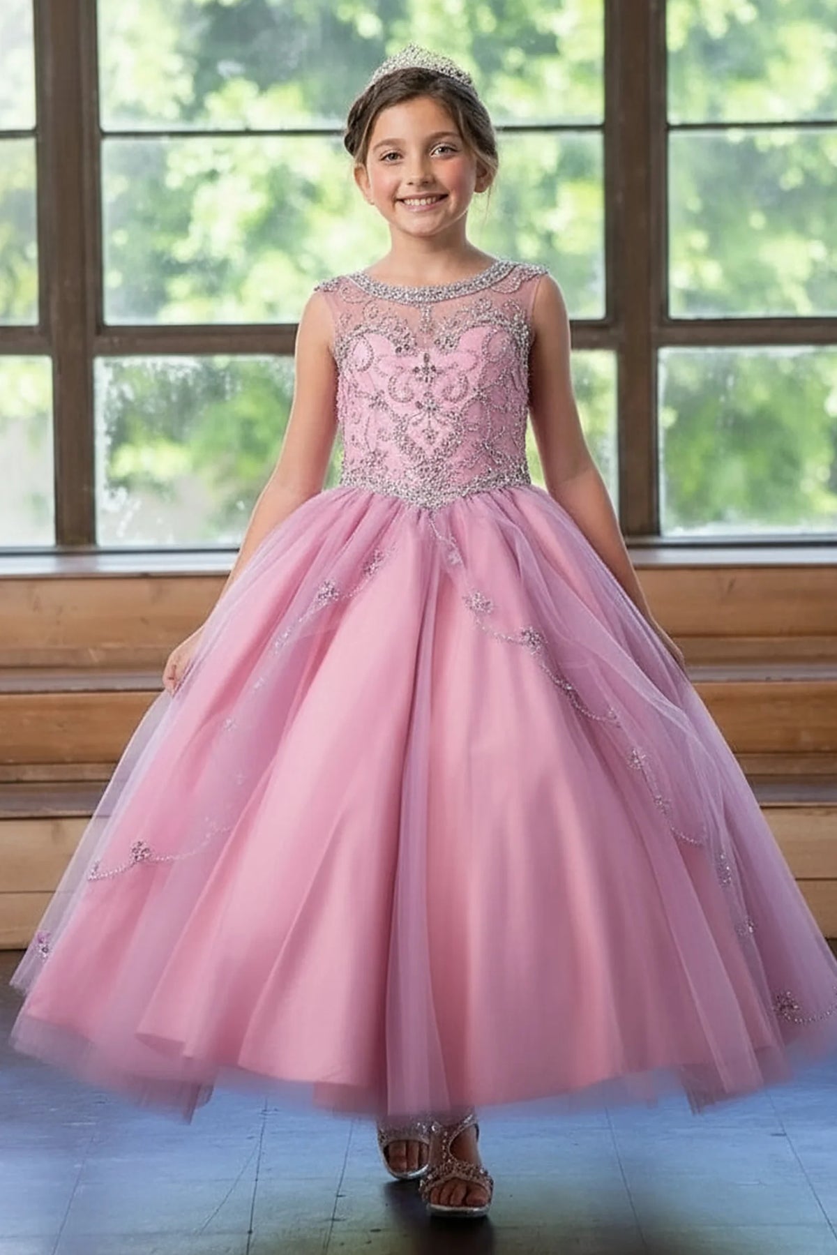 The formal silhouette presents, the Mauve Rose mini quince dress showcases floral embroidered fitted bodice and full tulle ball gown skirt with appliqué accents.