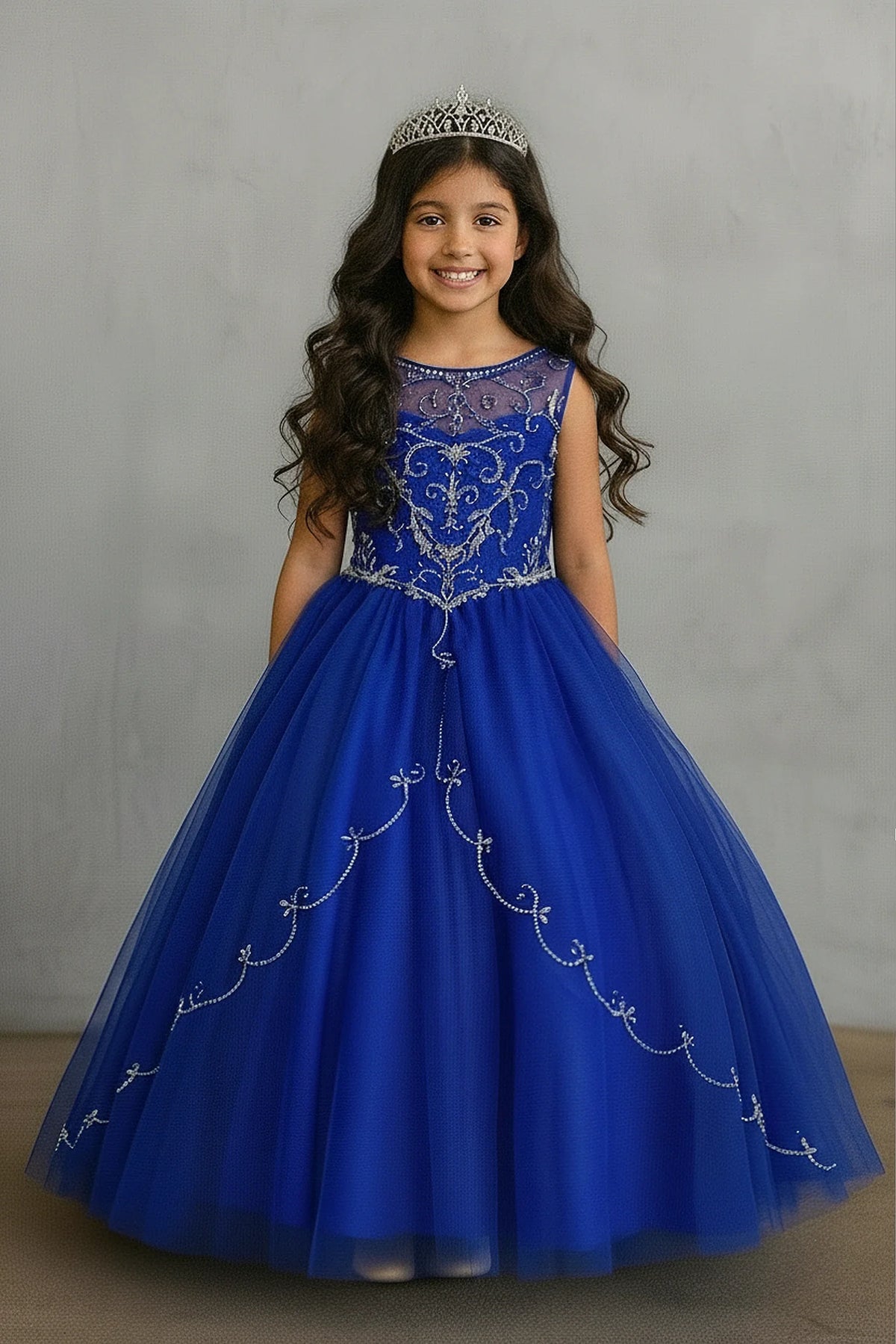 At the bodice and skirt, the Royal Blue mini quince dress showcases floral embroidered fitted bodice and full tulle ball gown skirt with appliqué accents.