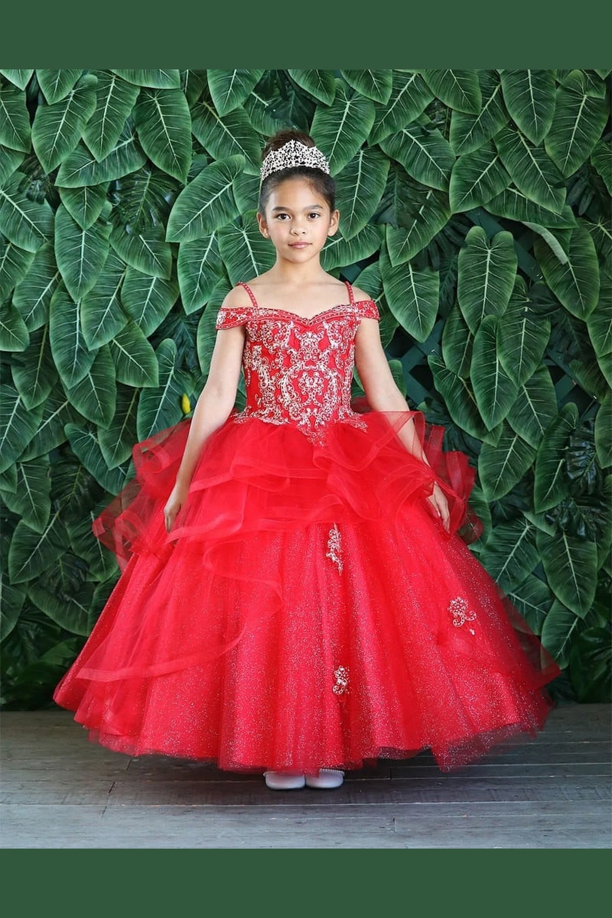 The reverse view reveals, the Red mini quince dress displays its lace-up finish and layered formal skirt with dimensional tiers.