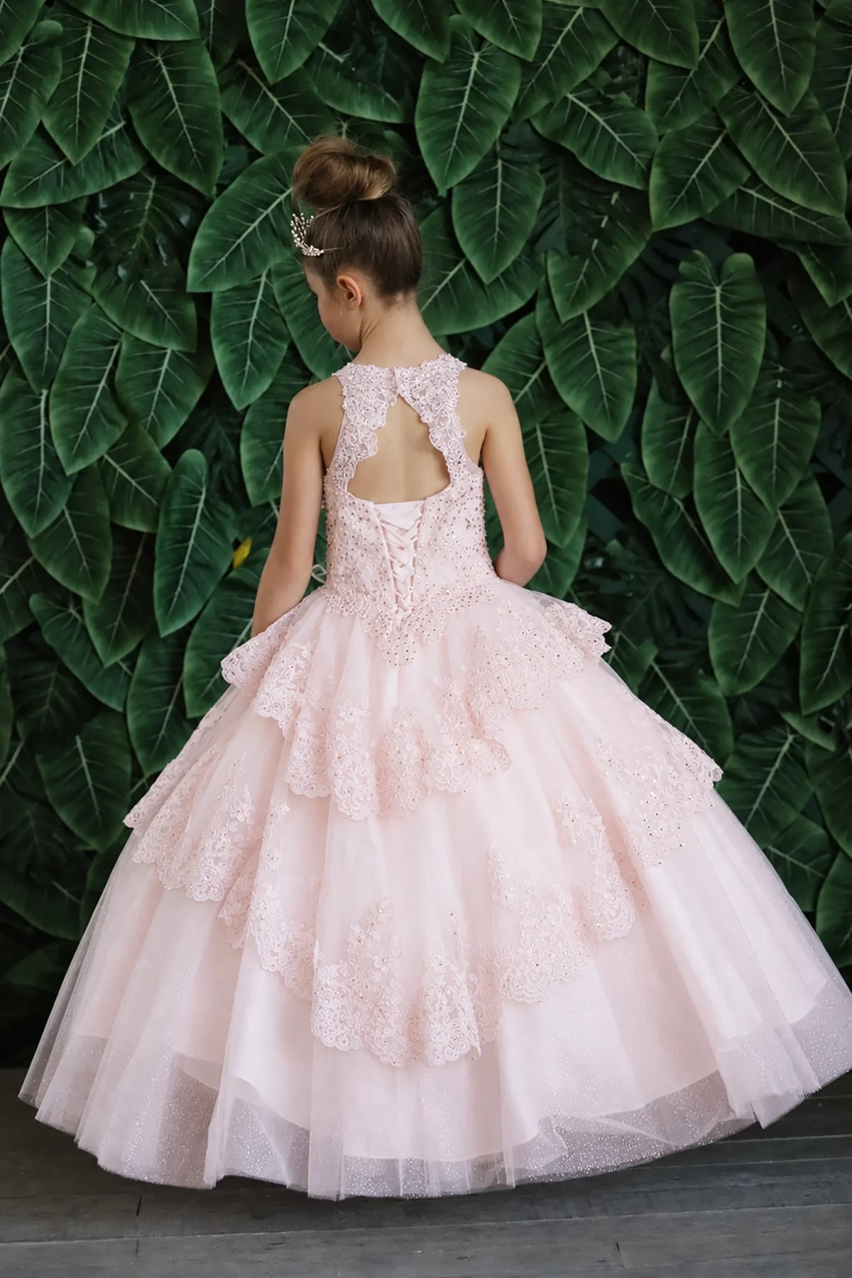 An alternate angle captures full layered tulle skirt with ruffle tiers on the Blush mini quince dress.
