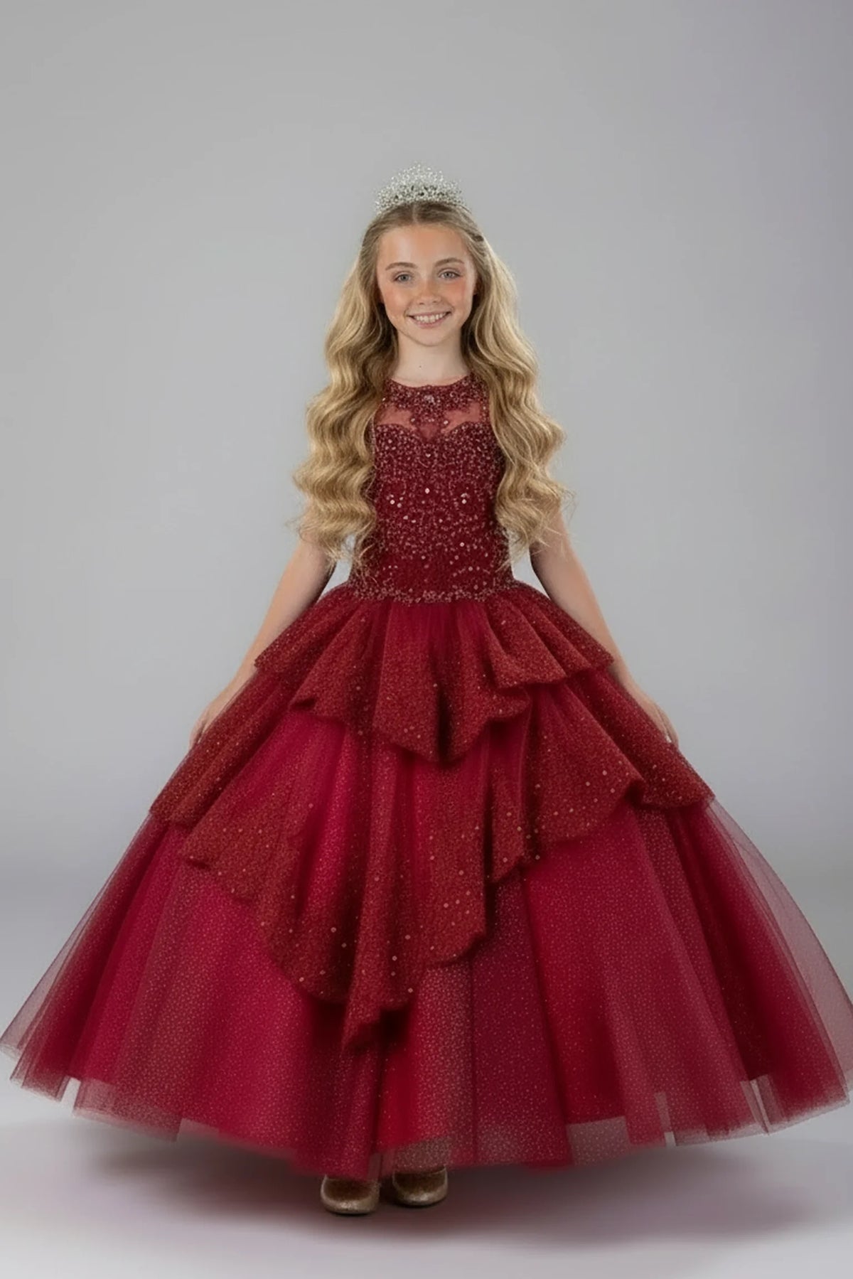 A closer crop highlights full layered tulle skirt with ruffle tiers on the Burgundy mini quince dress.